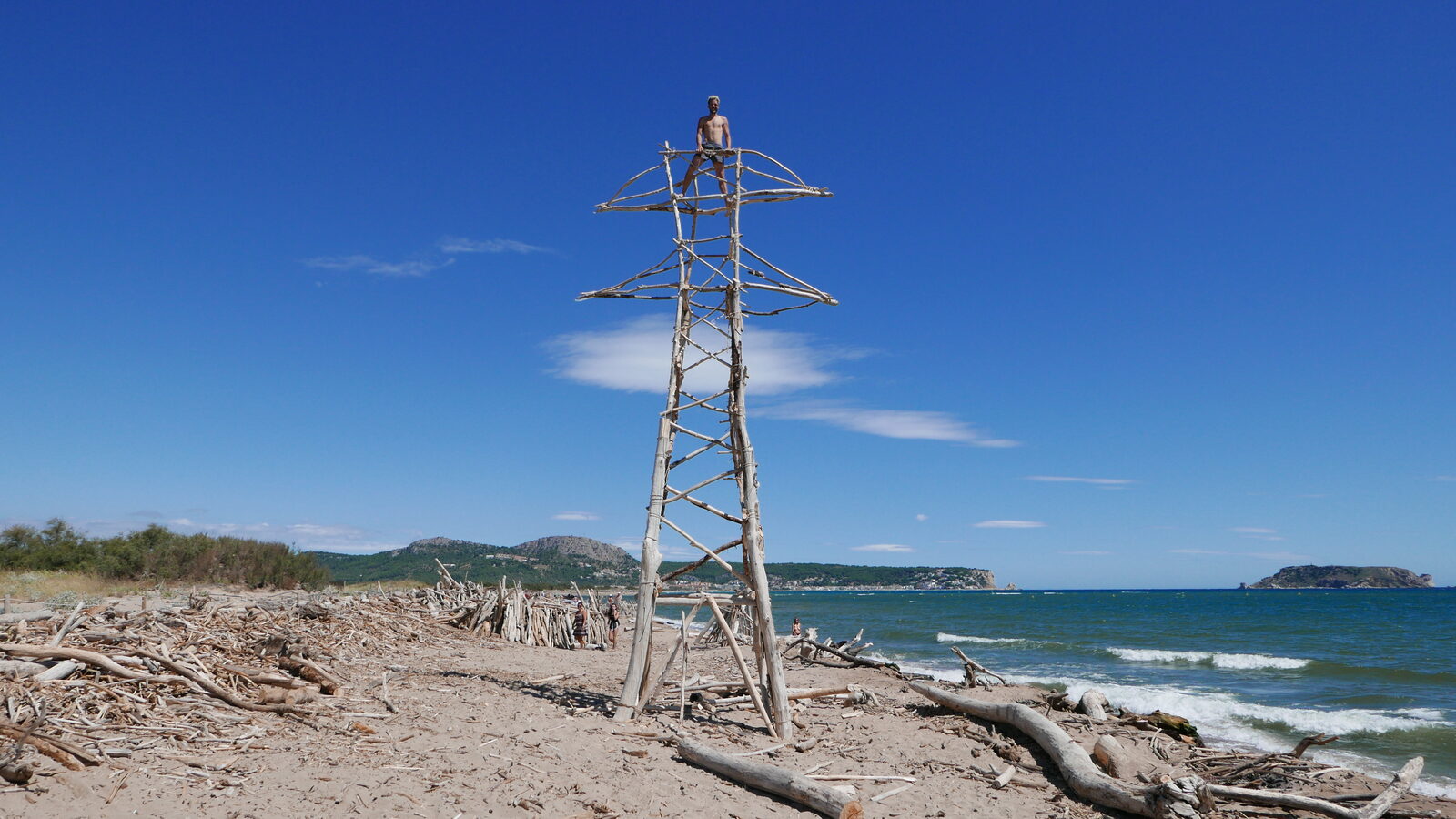 Power Tower I — the finished driftwood tower on the beach